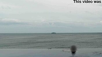 Chatting about relaxing by the infinity pool with scenic views