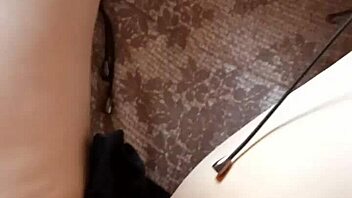 Gretala the hairy milf struts confidently in her tall boots for a teasing display.