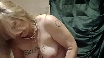 French housewife in bondage uses dildo and vibrator during solo session with chains and clamps