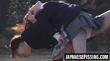 Cute japanese girl drinks then pees hard on bathroom floor before cleanup