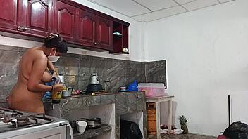 In the kitchen, my friend's tall and cute sibling expertly prepares a delicious homemade dinner with fresh ingredients.