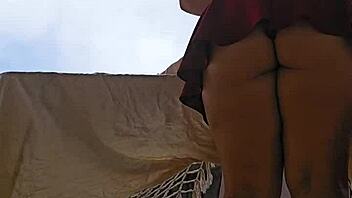 omg this naughty maid is flashing her big ass in a skirt on the balcony 😈