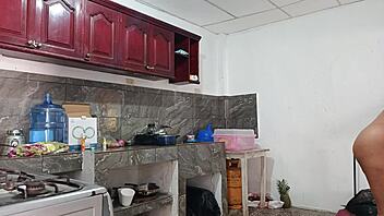 In the kitchen, my friend's tall and cute sibling expertly prepares a delicious homemade dinner with fresh ingredients.