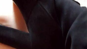 Gretala the hairy milf struts confidently in her tall boots for a teasing display.