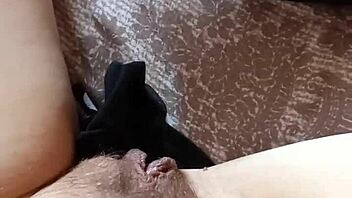 Gretala the hairy milf struts confidently in her tall boots for a teasing display.