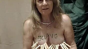 French housewife in bondage uses dildo and vibrator during solo session with chains and clamps