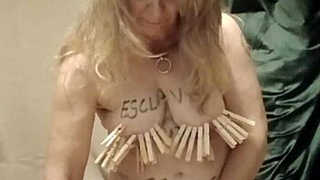 French housewife in bondage uses dildo and vibrator during solo session with chains and clamps