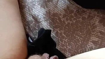 Gretala the hairy milf struts confidently in her tall boots for a teasing display.