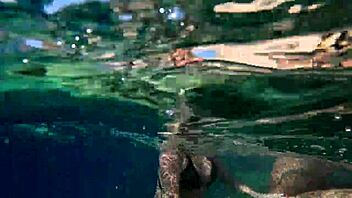 Hot milf enjoys underwater sex in the pool with big assets. She rides and licks in a steamy shower encounter.