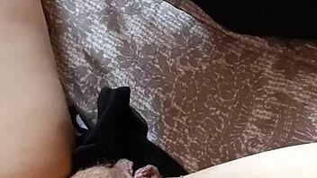 Gretala the hairy milf struts confidently in her tall boots for a teasing display.