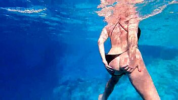 Hot milf enjoys underwater sex in the pool with big assets. She rides and licks in a steamy shower encounter.