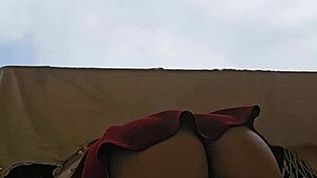 omg this naughty maid is flashing her big ass in a skirt on the balcony 😈