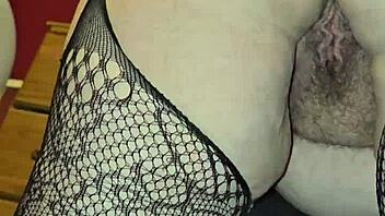 Sexy milf in fishnets spreads her ass cheeks wide