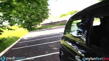 Brunette in black pantyhose shows off her feet from her car, wanna see this fetish tease?!