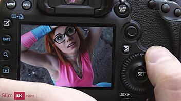 kira roller, the tattooed redhead, enjoys fun in her colorful outfit with glasses and stockings
