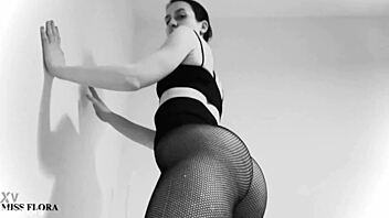 Fishnet tights tease ass and feet, but black and white contrast adds mystery