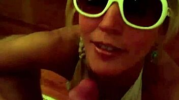 Blonde milf in bikini and glasses drains cock with sloppy blowjob