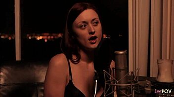 Two women share a podcast story that evolves into a tender intimate moment together