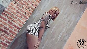 why is this ebony stripper twerking her big tits and ass in a sexy dress at the club?