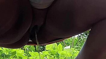 Feeling exposed as milf takes a public outdoor piss on the street