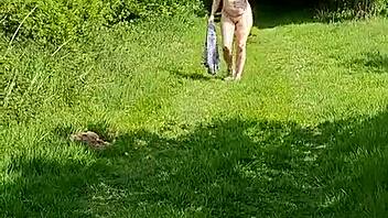 hey, check out this naughty housewife strolling naked through the gardens