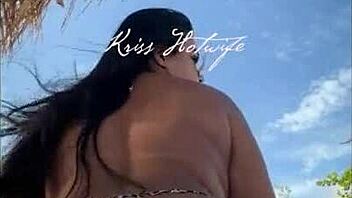 hey, check out this married hooker flaunting her huge ass in tiny bikini on the beach?