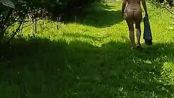 hey, check out this naughty housewife strolling naked through the gardens