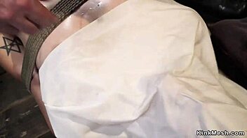 I see this brunette in one leg inverted suspension getting choked and whipped roughly