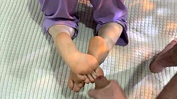 Stepmother with new pedicure gives stepson detailed footjob in bedroom, using feet and toes for orgasmic couple massage