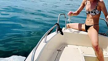 Boat wash turns fun with sexy blonde babe in thong swimsuit enjoying the beach vibes