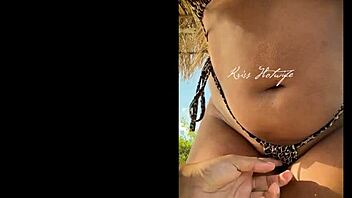 hey, check out this married hooker flaunting her huge ass in tiny bikini on the beach?