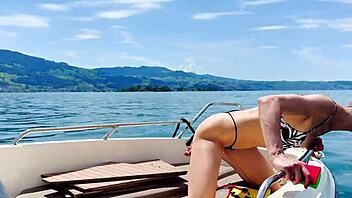 Boat wash turns fun with sexy blonde babe in thong swimsuit enjoying the beach vibes