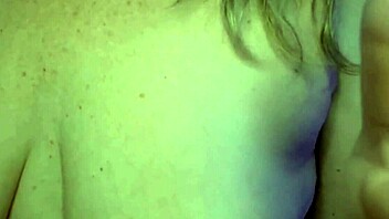 Woman spreads cum on body