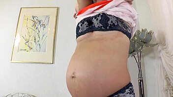 Busty pregnant babe moans while dildoing her wet pussy in homemade solo