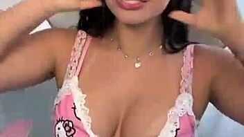 Why Does Emanuelly Raquel Tease With Dirty Talk And Oil On Her Big Boobs?