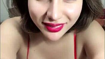 in a casual bedroom setting, vietnamese beauty shows off her big boobs and ass on bigo live