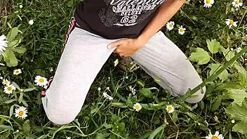 Hey, I caught my neighbor masturbating wildly in the daisies - such a hot orgasm spy moment! 👀🌼