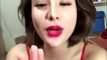 in a casual bedroom setting, vietnamese beauty shows off her big boobs and ass on bigo live