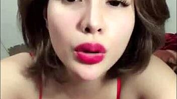 in a casual bedroom setting, vietnamese beauty shows off her big boobs and ass on bigo live