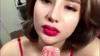 in a casual bedroom setting, vietnamese beauty shows off her big boobs and ass on bigo live