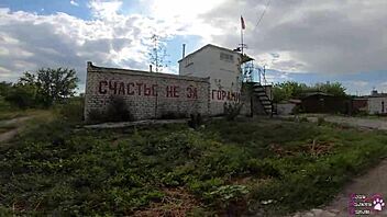 Horny brunette student delivers sloppy blowjob and swallows cum behind the garages in public