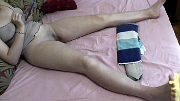 Sexy blonde milf and cute brunette explore handjob and fingering on bed. They paint toes and show big ass close up in stockings.