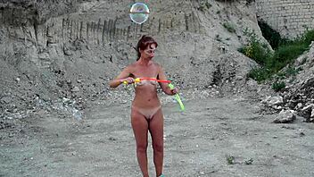 soap bubbles outdoor fun with mature wife getting naked