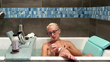 Why does Milf Stella's solo bath turn into a steamy pussy and body shaving fetish session