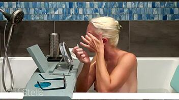 Why does Milf Stella's solo bath turn into a steamy pussy and body shaving fetish session