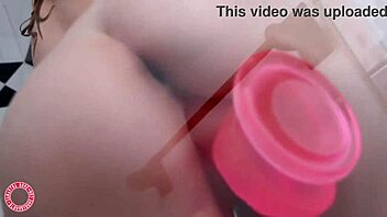 Green-eyed blonde Samantha Rone enjoys her dildo in the shower for wet solo fun