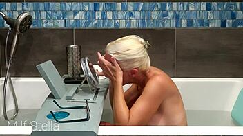 Why does Milf Stella's solo bath turn into a steamy pussy and body shaving fetish session