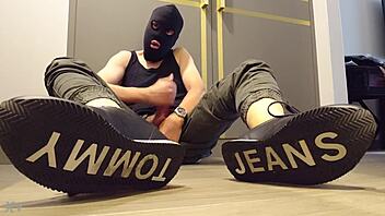 Guy masturbates while wearing sneakers