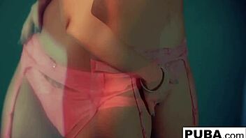 britney amber enjoys solo play against blue wall