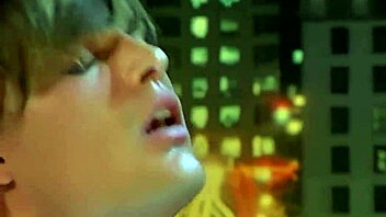 Busty blonde SUCKING two cocks in vintage orgy scene.